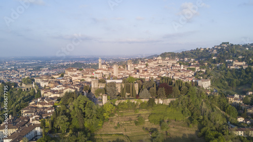 Drone aerial view of Bergamo - Old city. One of the beautiful city in Italy. Landscape on the city center, its historical buildings and towers during a wonderful blu day