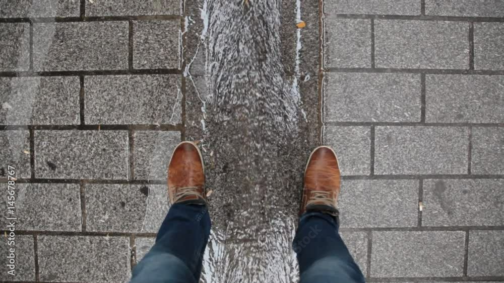 Wet stone tiles in urban street, construction Wet stone tiles in urban street, construction