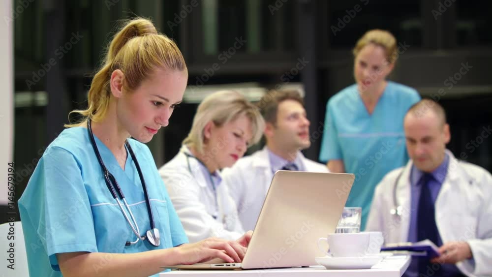 Nurse using laptop in conference room Nurse using laptop in conference room