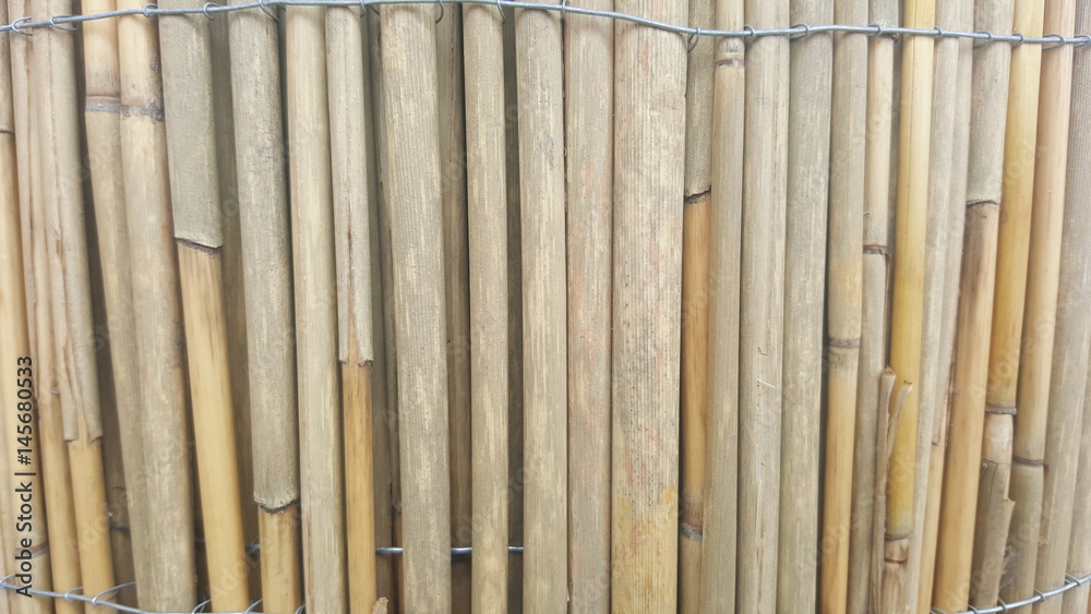 Texture of yellow bamboo fence for background Texture of yellow bamboo fence for background