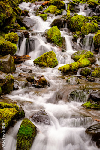 Waterfall flowing over mossy rocks