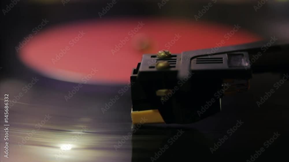 A retro-styled spinning record vinyl player. 4k. Close up. A retro-styled spinning record vinyl player. 4k. Close up.