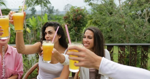 People Group Clink Juice Glasses Eating Healthy Vegetarian Food, Friends Communication Sitting At Table On Tropical Terrace Slow Motion 60