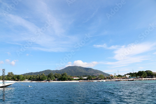 Tropical island country beautiful blue sea and clear blue sky,Image for summer fun party travel concept.