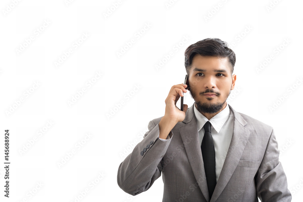 A Yong businessman are using smartphone on white background A Yong businessman are using smartphone on white background