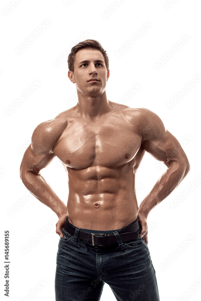 Muscular handsome young man with naked torso. Isolated on white background.