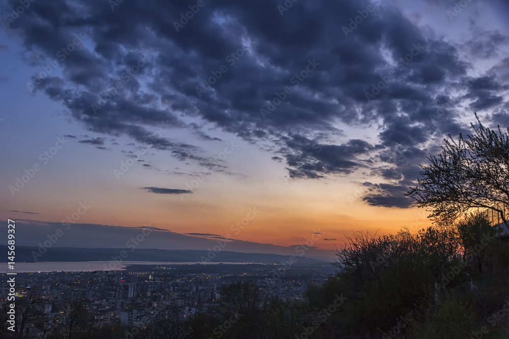 Beautiful sunset with dramatic clouds over the city . Varna, Bulgaria Beautiful sunset with dramatic clouds over the city . Varna, Bulgaria
