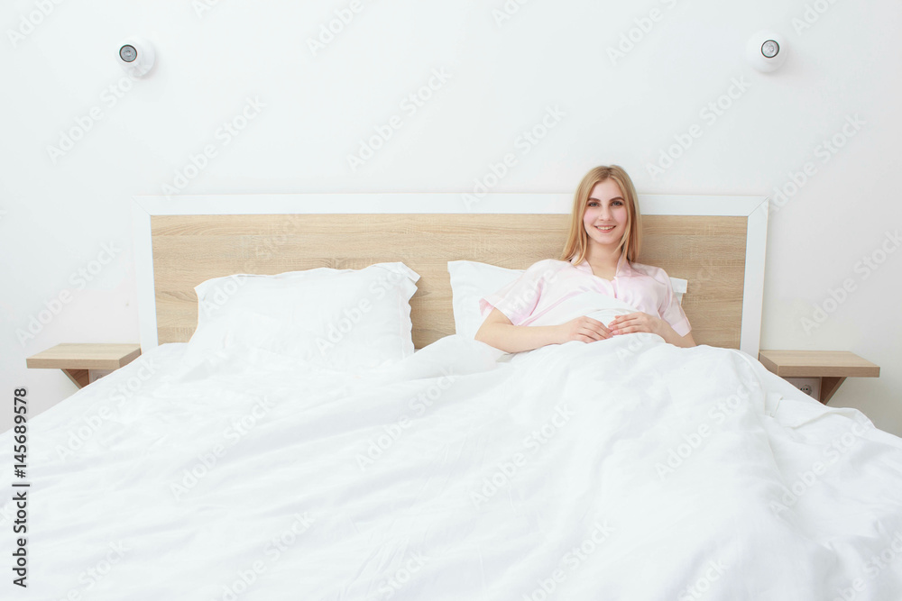 A beautiful girl resting on the bed