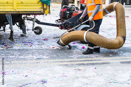 Konstfotografi Street cleaner with industrial vacuum cleaner
