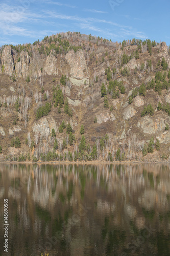 the mountains are reflected in the water