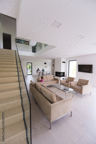 family with little girl enjoys in the modern living room