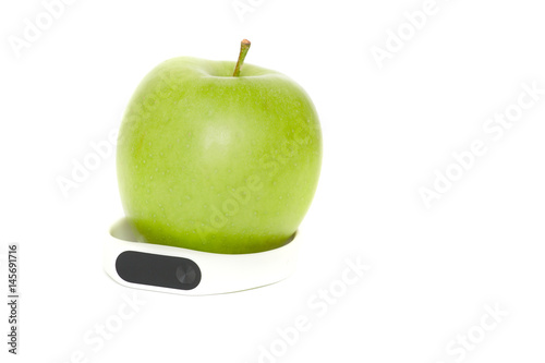 Health life concept. Fitness tracker, green apple isolated on white background