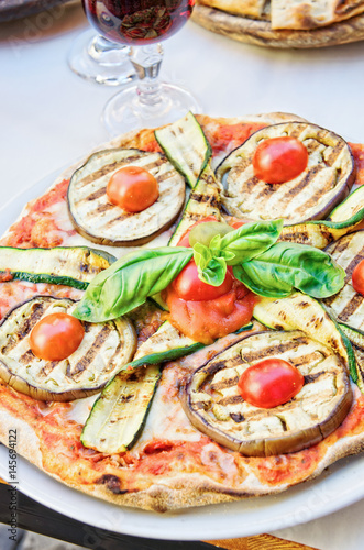 Veggie pizza on a table with copy space