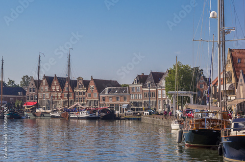 Boats and old houses in the harbor of Hoorn