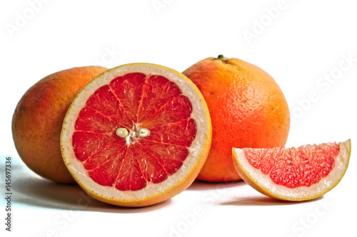 Closeup of red grapefruits on a white background
