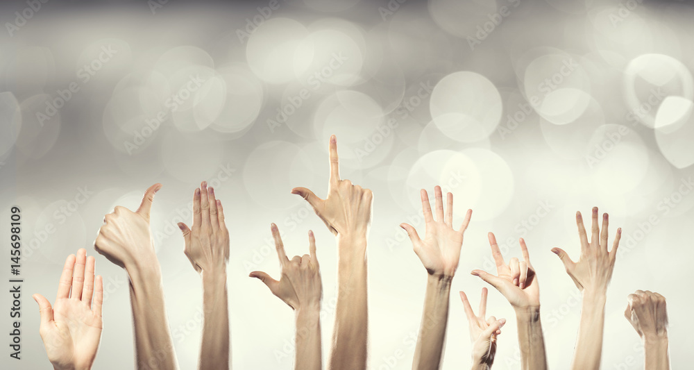 Group of people rise hands Group of people rise hands