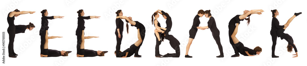 Black dressed people forming word FEEDBACK Black dressed people forming word FEEDBACK