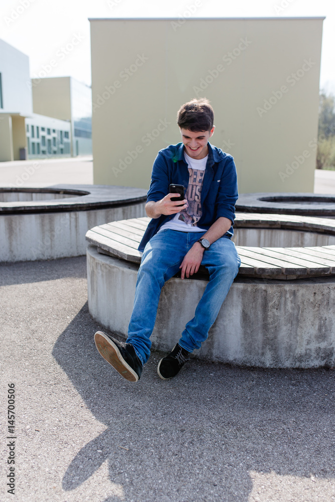 Young man checking his smartphone