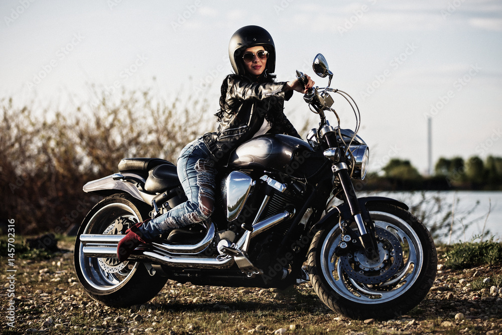 Beautiful brunette woman with a classic motorcycle (cinema bleach bypass effect) Beautiful brunette woman with a classic motorcycle (cinema bleach bypass effect)