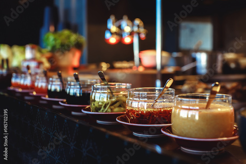 Sauces and condiments in jars photo