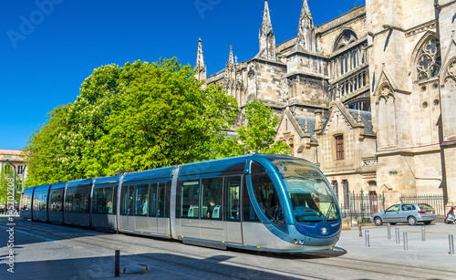 City tram at the Cathedral of Bordeaux, France photo