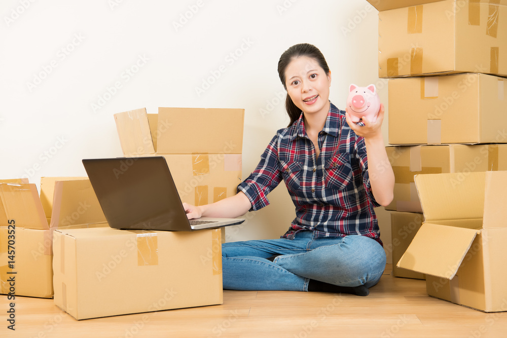 woman research for moving with money piggy woman research for moving with money piggy
