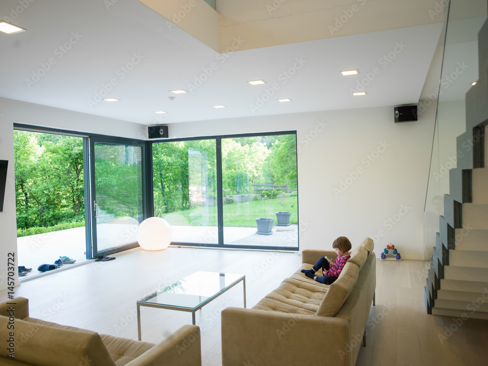 little girl playing games on smartphone