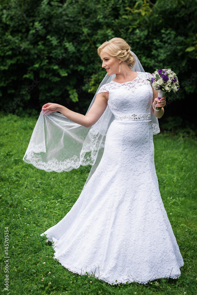 Bride posing in her wedding day Bride posing in her wedding day