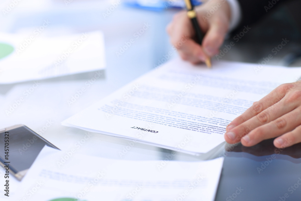 Business man signing a contract Business man signing a contract