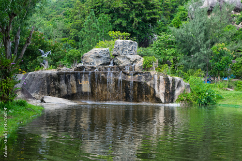 Waterfall and a lake in a park at Orchid Island, Vietnam