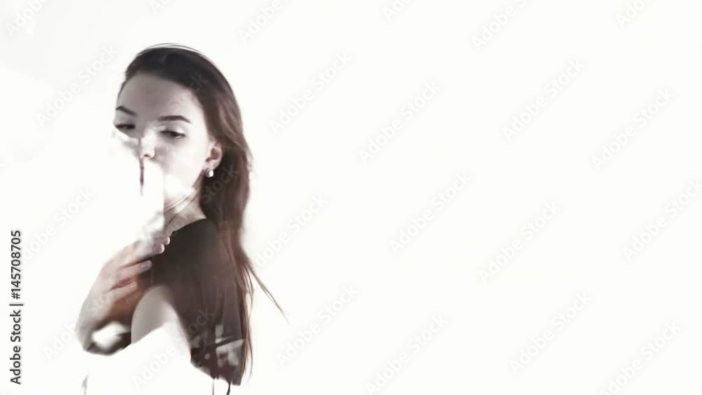 Double exposure. woman against the background lights of evening traffic Double exposure. woman against the background lights of evening traffic