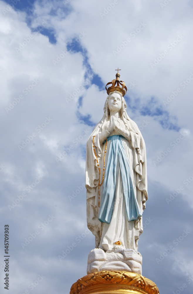 Our Lady, Virgin Mary, Mother of God in cloud sky