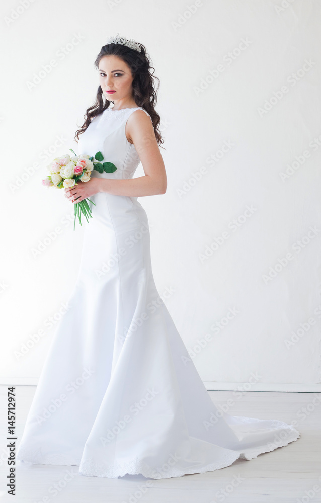 bride in white wedding dress with a bouquet of flowers bride in white wedding dress with a bouquet of flowers
