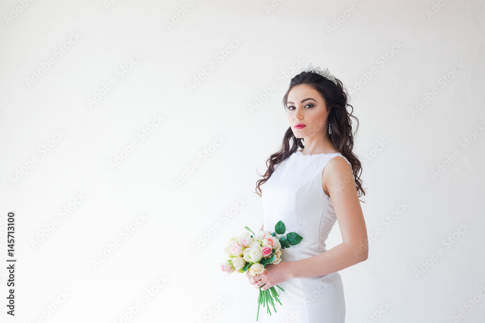 bride in white wedding dress with a bouquet of flowers bride in white wedding dress with a bouquet of flowers