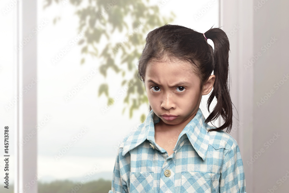 Portrait of asian little girl with unhappy face Portrait of asian little girl with unhappy face