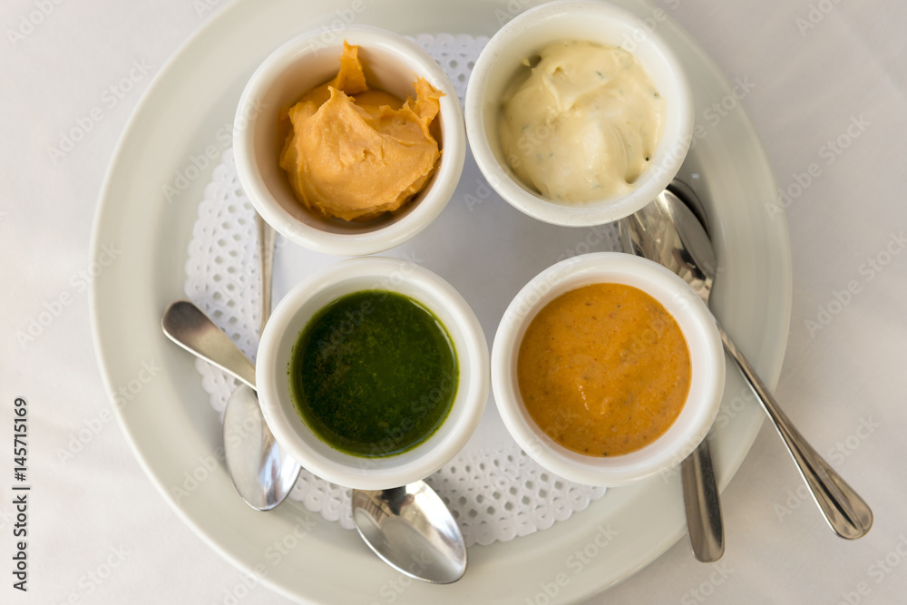 Overhead of Dip Sauces and Dressing in Bowls on Plate Overhead of Dip Sauces and Dressing in Bowls on Plate