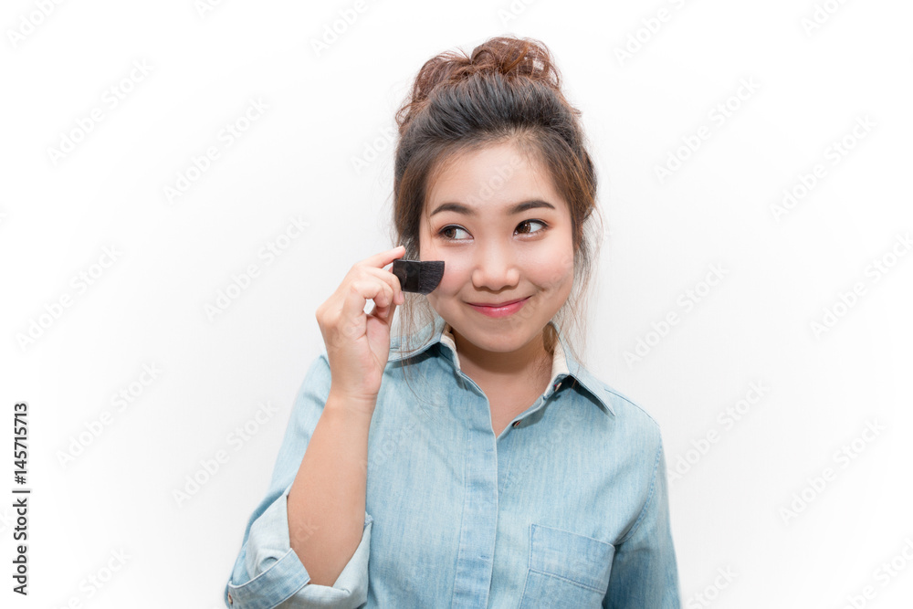 Beautiful asian young woman handle small brush for make up Beautiful asian young woman handle small brush for make up