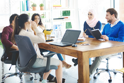 Business people talking in office meeting .