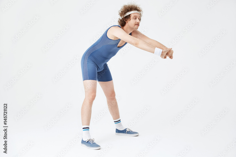 Man stretching back with hands forward. Looking fresh and rested Man stretching back with hands forward. Looking fresh and rested