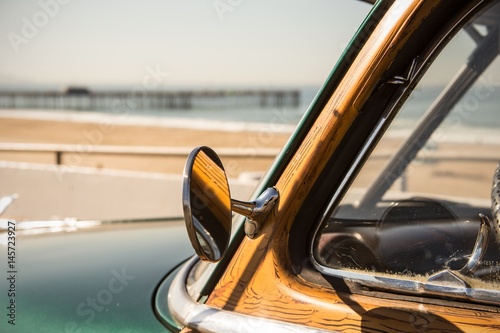 woody surf car in california at the beach with pier photo