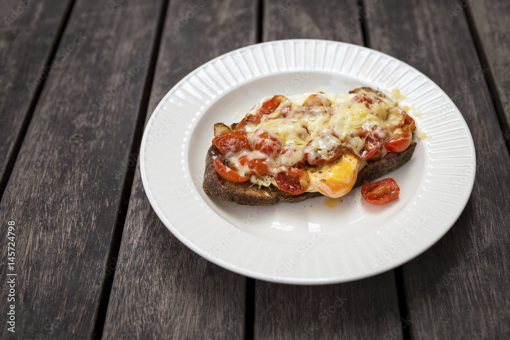 Tomato and egg on toast top with cheese, healthy breakfast Tomato and egg on toast top with cheese, healthy breakfast