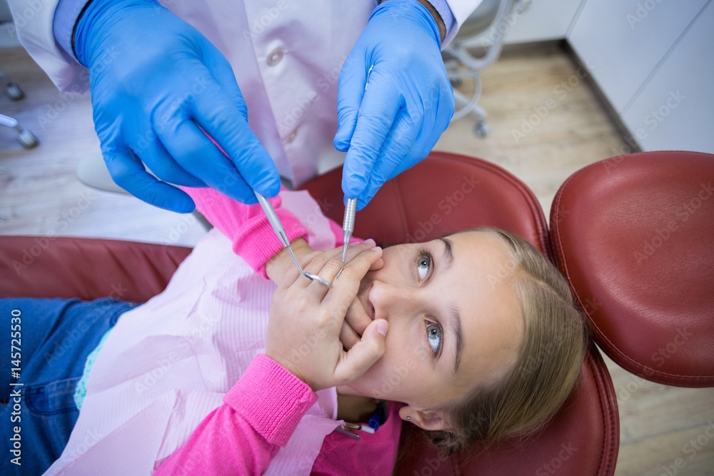 Young Patient Scared During A Dental Check up Stock Foto Adobe Stock young-patient-scared-during-a-dental-check-up-stock-foto-adobe-stock