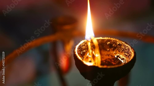 Candle flame close-up in the Indian Temple on a Religious Festival Diwali. Oil Lamp