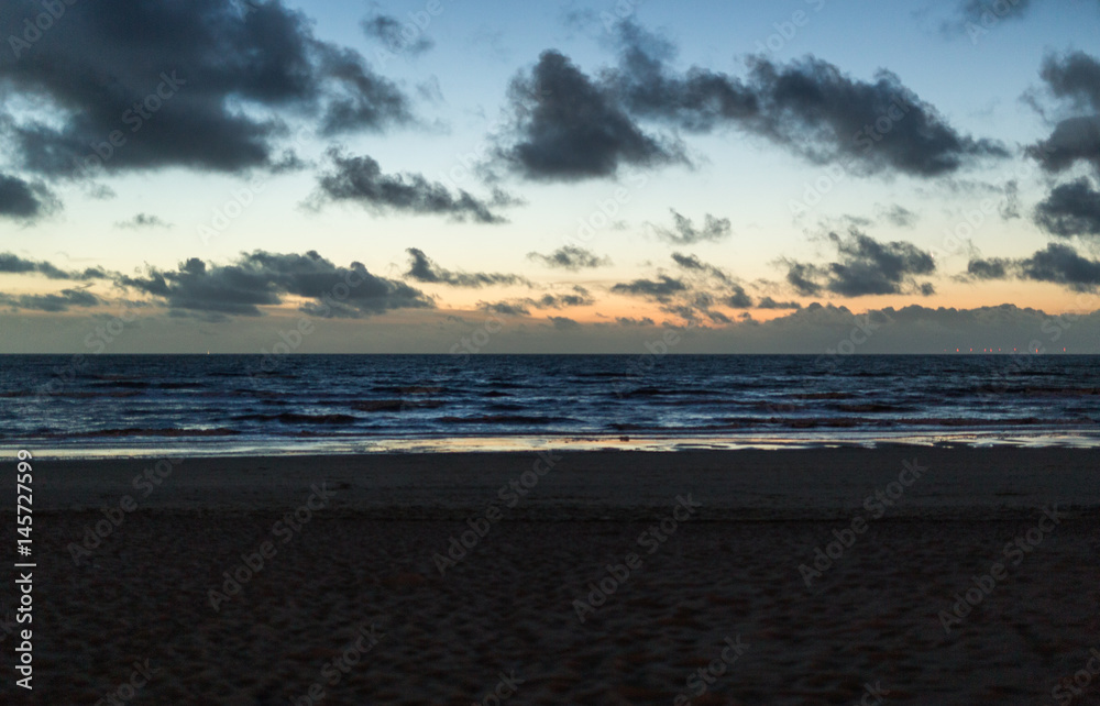 Katwijk aan Zee, Walking in the evening omn the beach Katwijk aan Zee, Walking in the evening omn the beach