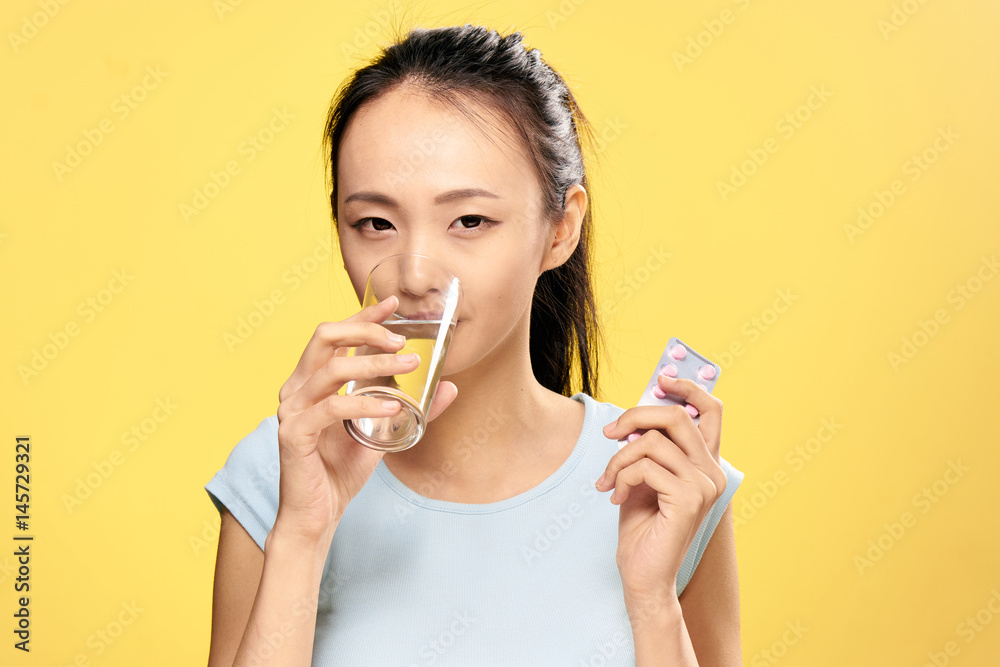 woman with a glass of water, pill, treatment, vitamins woman with a glass of water, pill, treatment, vitamins