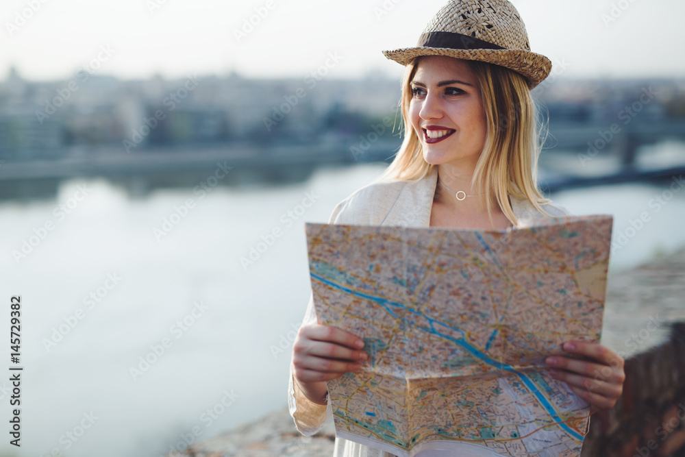 Happy female tourist sightseeing and exploring
