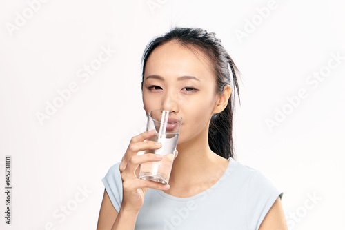 woman with a transparent glass of water