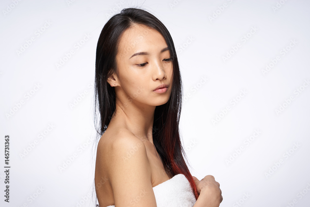 pretty woman with a clean delicate skin, Asian appearance pretty woman with a clean delicate skin, Asian appearance