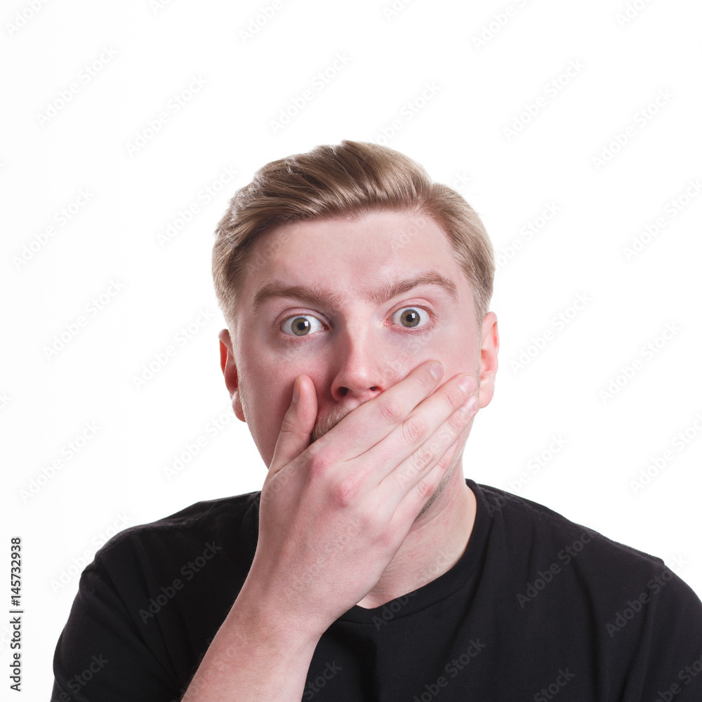 Gossiping, surprised man covering mouth with hand Gossiping, surprised man covering mouth with hand