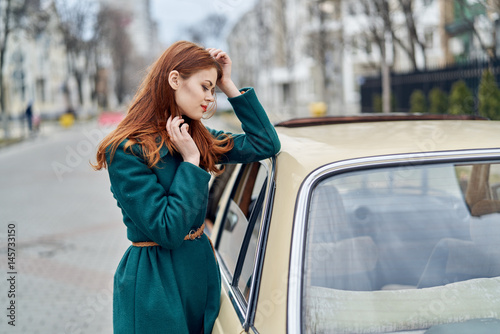 a woman is standing near a car, problems on the road © SHOTPRIME STUDIO